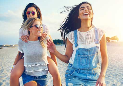 Three woman walking on the beach